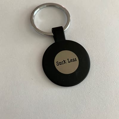 suck less keychain
